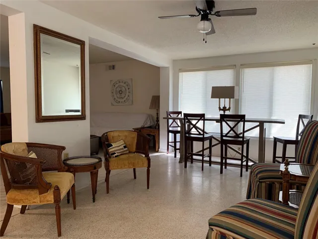 Florida room, additional dining or workspace, and seating.