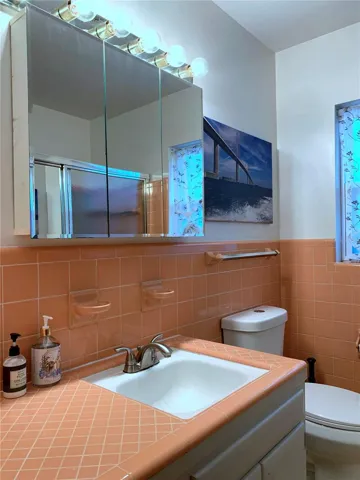 Medicine cabinet for your toiletries and sundries and a decent amount of counter space to the left of the wide sink.