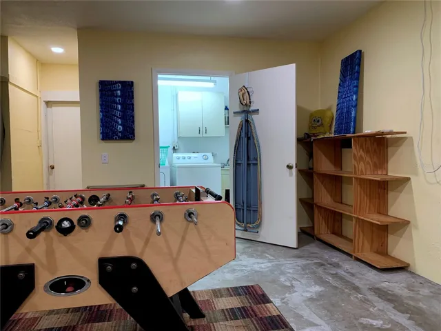 Looking across the foosball table into the laundry room. The door in the background goes out to the back porch.