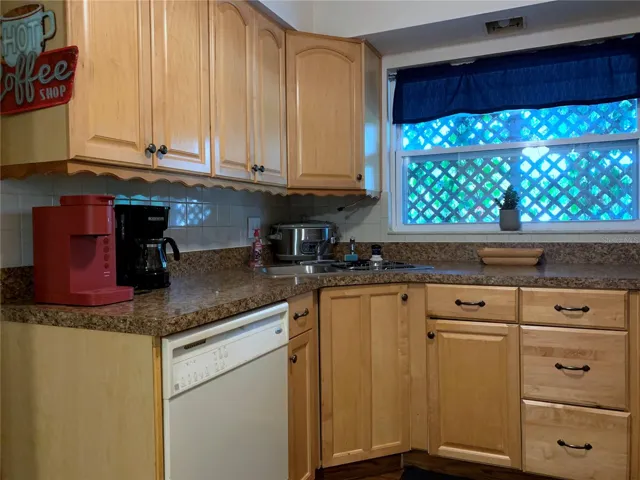 Kitchen with crock pot, a Keurig pod coffee machine and a 4 cup coffee maker.