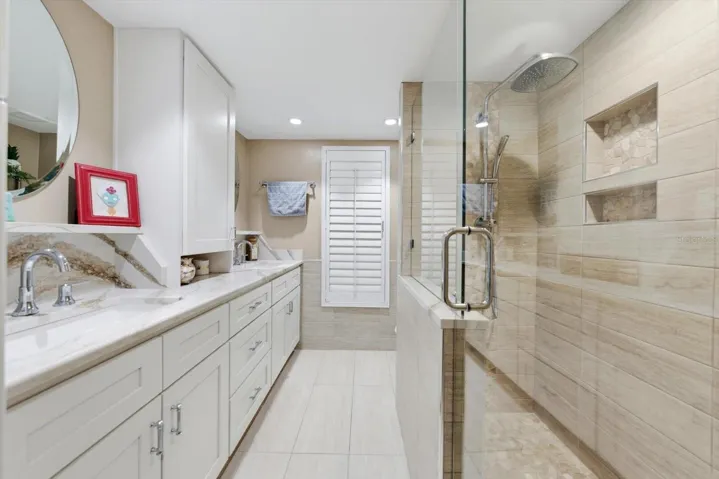 Guest Bathroom 1 with double vanites that also leads out to the pool area