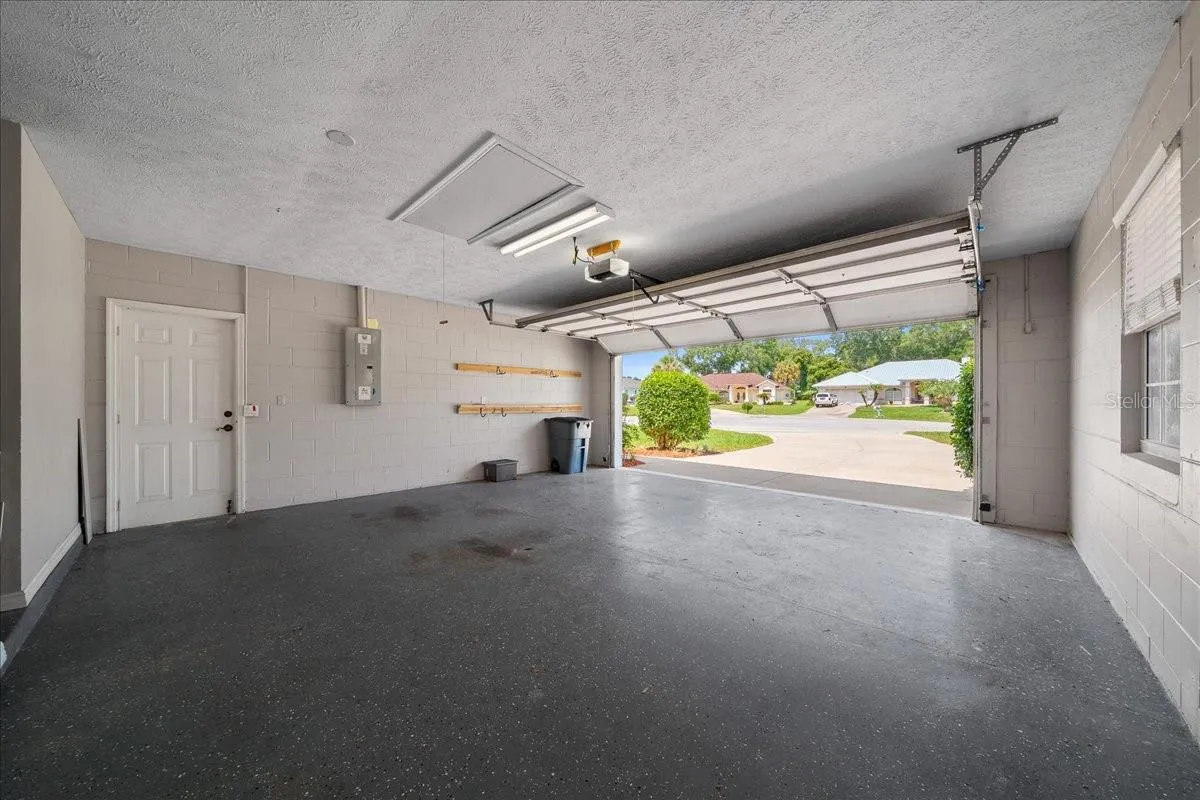 Two car garage w/attic stairs
