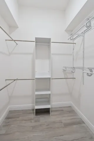 One of the Two Primary Walk-In Closets