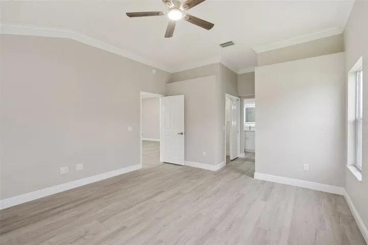 Owner's Suite with En-suite Bath and His/Hers Walk-in Closets