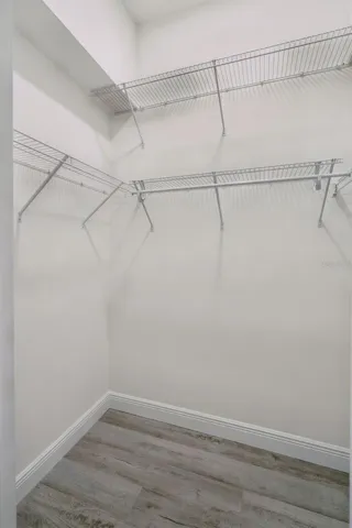One of the Two Primary Walk-In Closet