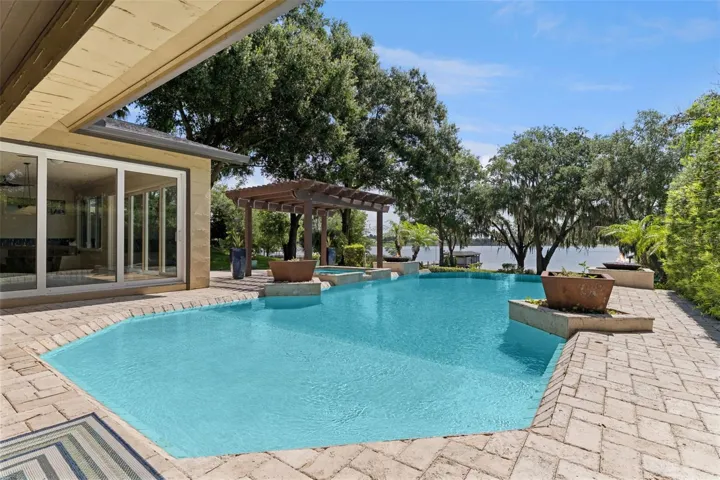 Infinity Pool and Spa.     Decorative planters and two natural gas fed fire pit features complete the luxury pool experience
