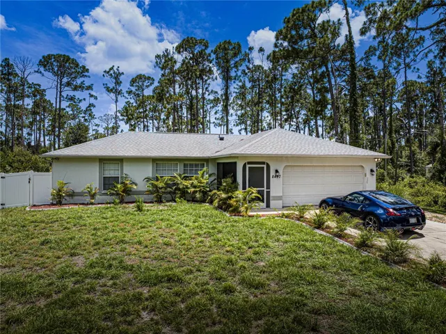 Front elevation on large fenced lot