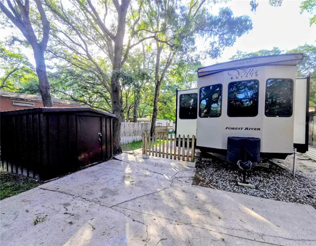 Shed on property for extra storage with a washer and dryer