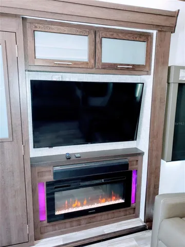 Big screen TV and fireplace