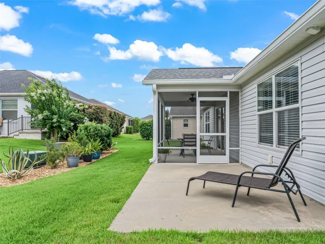 adjacent concrete patio extension