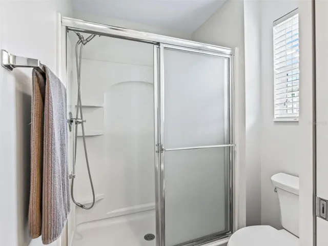 Primary Bathroom: private, windowed WC, a separate walk-in shower