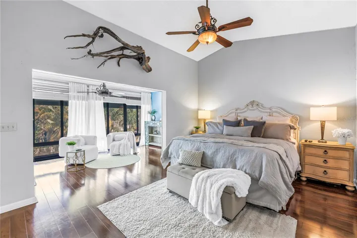 Luxurious Primary Suite with Lounge or Workout area and View of the Backyard Pool