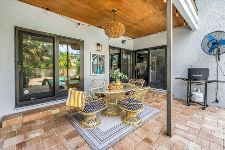Full Shady Dining al Fresco and Grilling venue.  Wood Paneled ceiling brings the spa and luxury feel to the outside