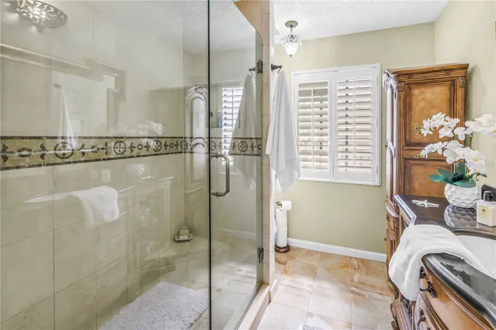 Seamless Glass Shower in the Primary Suite with privacy and convenience