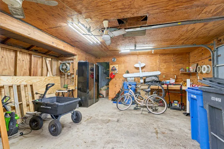 Detached over-sized 2 car garage with 1 car garage separated by wall
