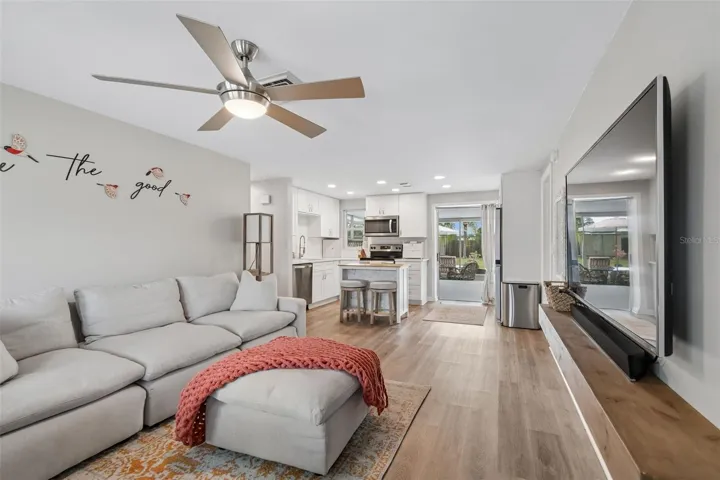 Lots of natural light to take the cozy setting in the center of house.   With the open concept of this space entertaining space flows effortless between the living room/kitchen to the patio/pool area.