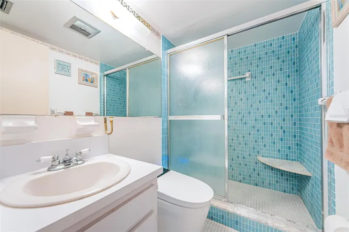 Guest bathroom with walk-in shower and smart toilet