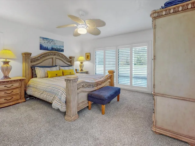 On to the Primary bedroom. Also fully adorned with plantation shutters