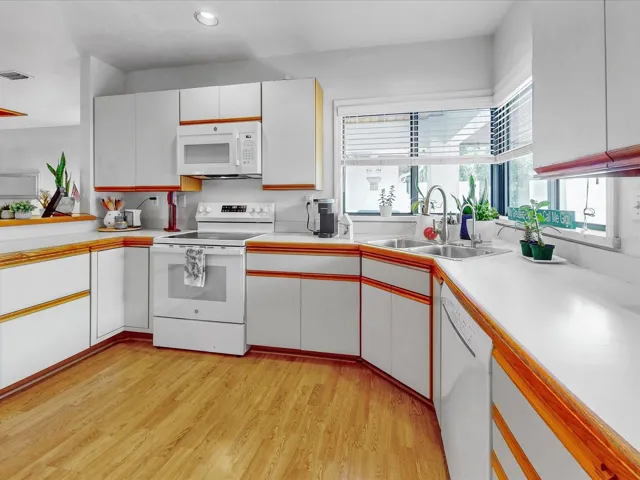 Drawers, doors, and lazy susans adorn this large kitchen. Lots of pullout's too