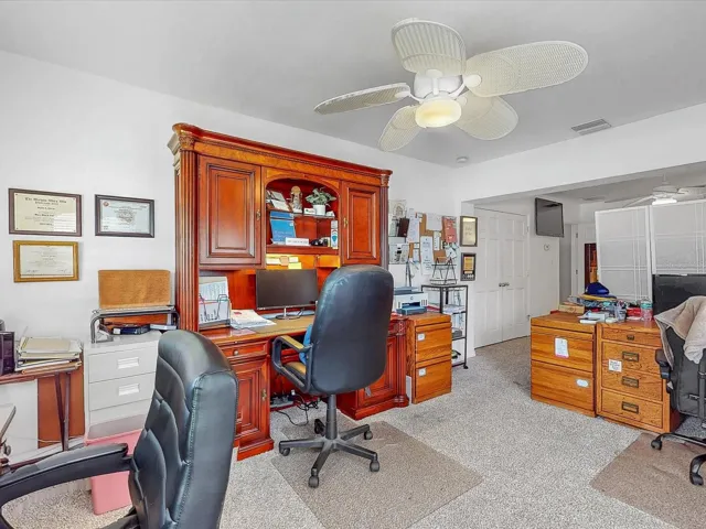 Three large desks in this space currently