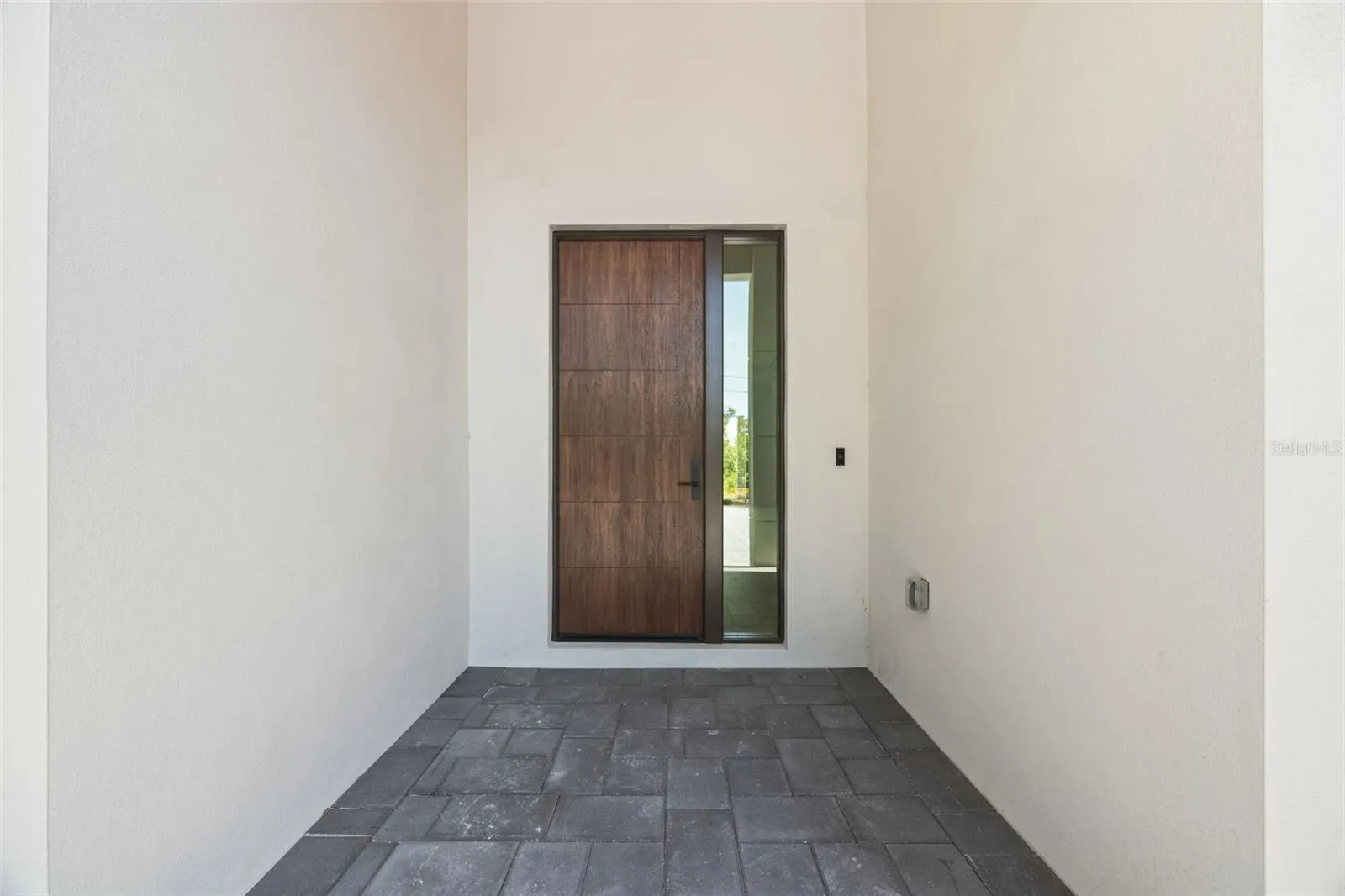 Premium Mastergrain Cherry fiberglass entry door with:Multipoint locking system, impact-rated Low-E sidelight,EMTEK designer hardware,realistic woodgrain finish with advanced, Nickel Vapor Deposition technology.