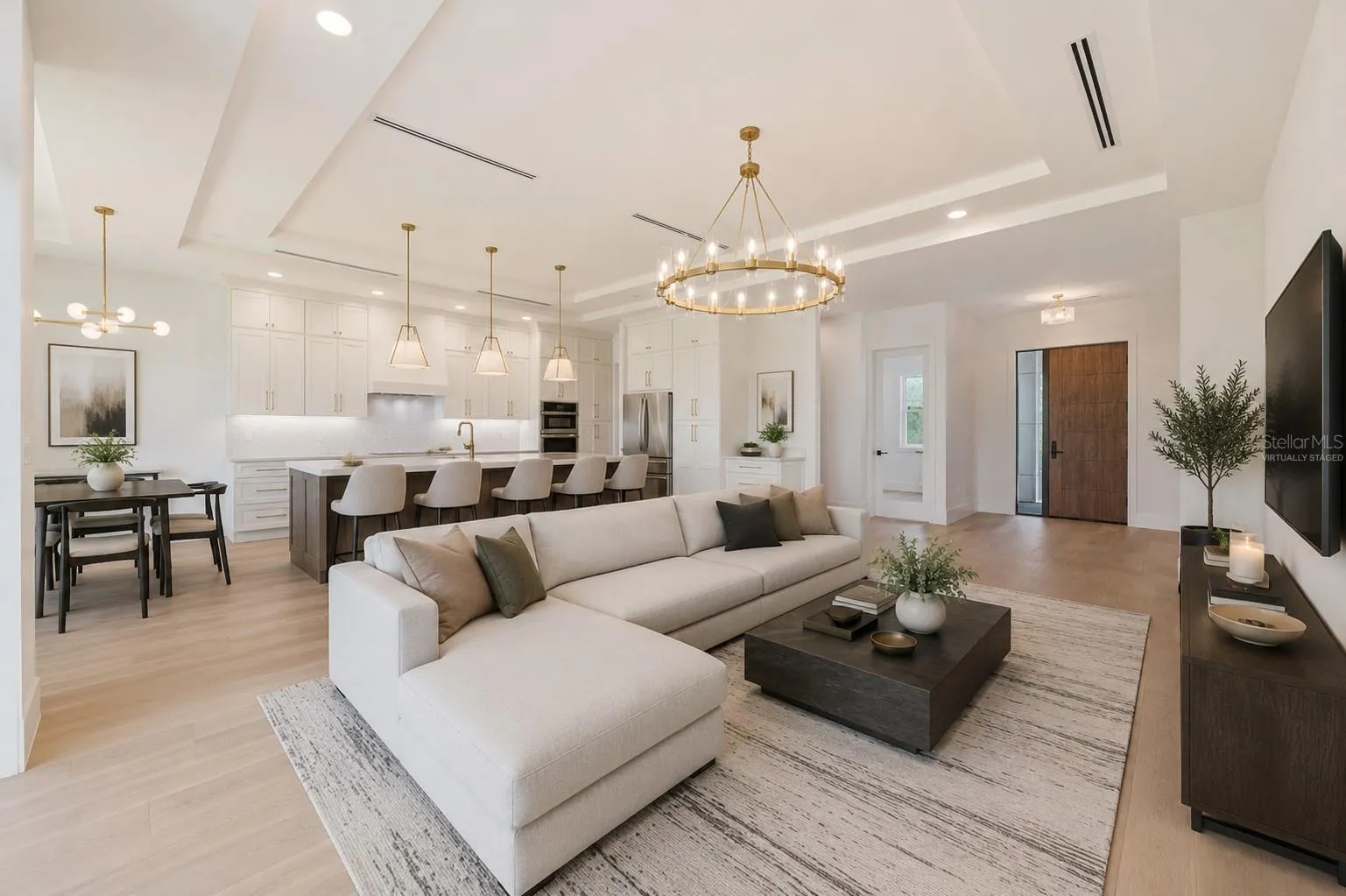 Virtually staged.Living Room / Kitchen / Dining area/ Front door.