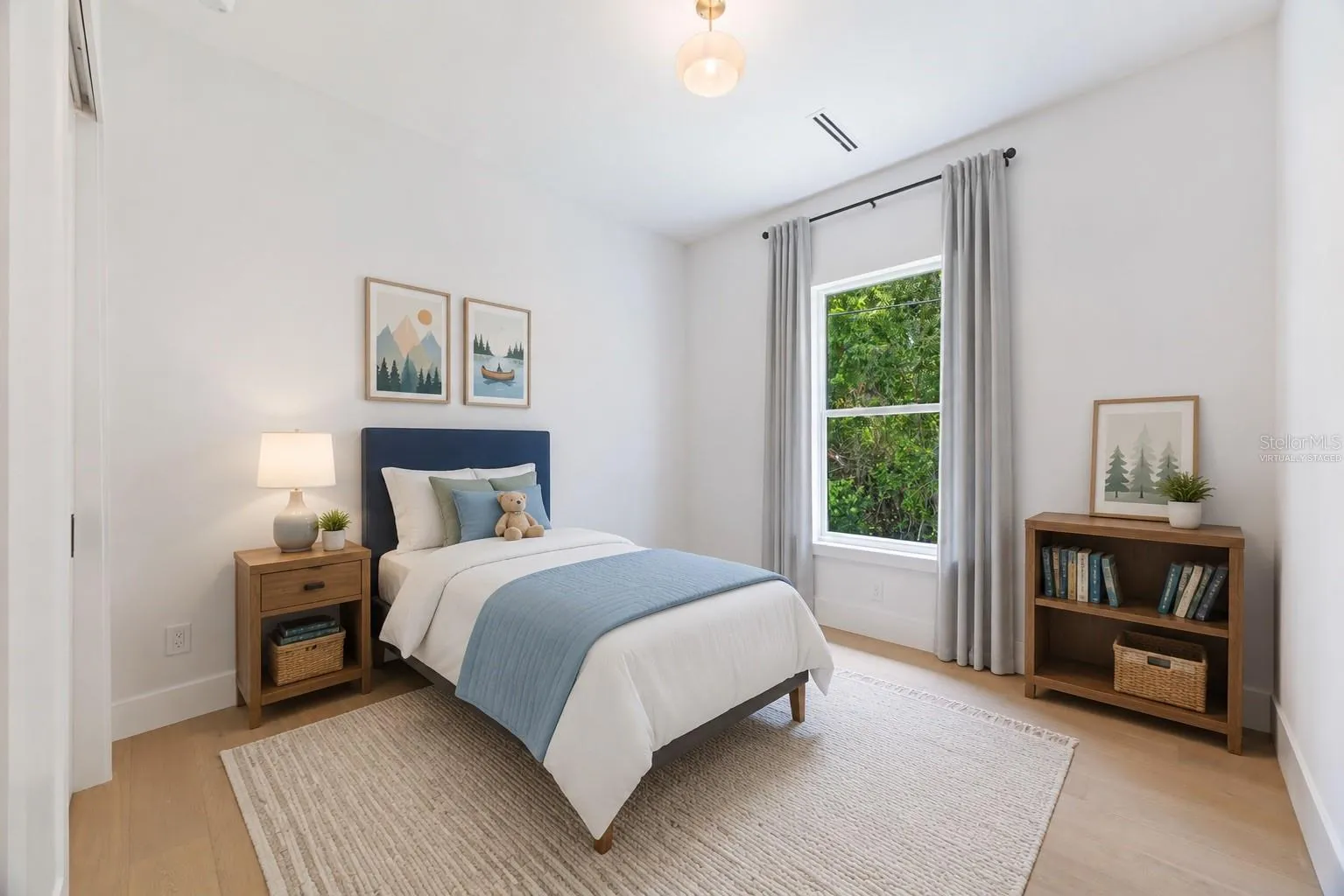 Virtually staged. Spacious bedroom 3 with impact-rated window, solid-core door, and convenient access to a full bath.