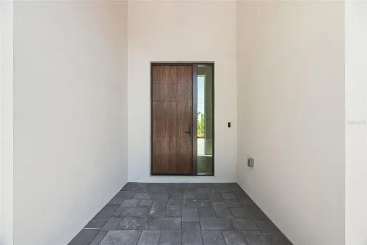 Premium Mastergrain Cherry fiberglass entry door with:Multipoint locking system, impact-rated Low-E sidelight,EMTEK designer hardware,realistic woodgrain finish with advanced, Nickel Vapor Deposition technology.