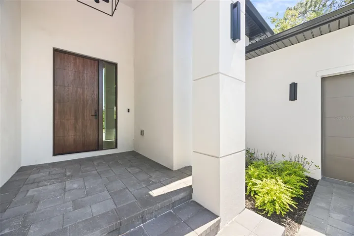 Premium Mastergrain Cherry fiberglass entry door with:Multipoint locking system, impact-rated Low-E sidelight,EMTEK designer hardware,realistic woodgrain finish with advanced, Nickel Vapor Deposition technology.