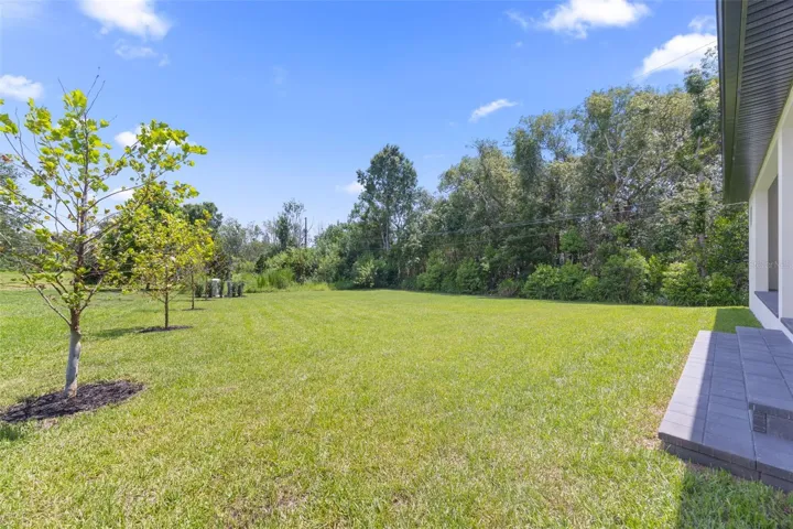 The oversized homesite backing to a conservation area provides a rare combination of privacy, natural beauty, and room to enjoy Florida living at its finest.