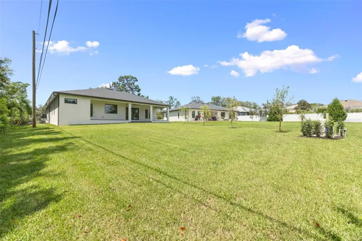 The oversized homesite backing to a conservation area provides a rare combination of privacy, natural beauty, and room to enjoy Florida living at its finest.