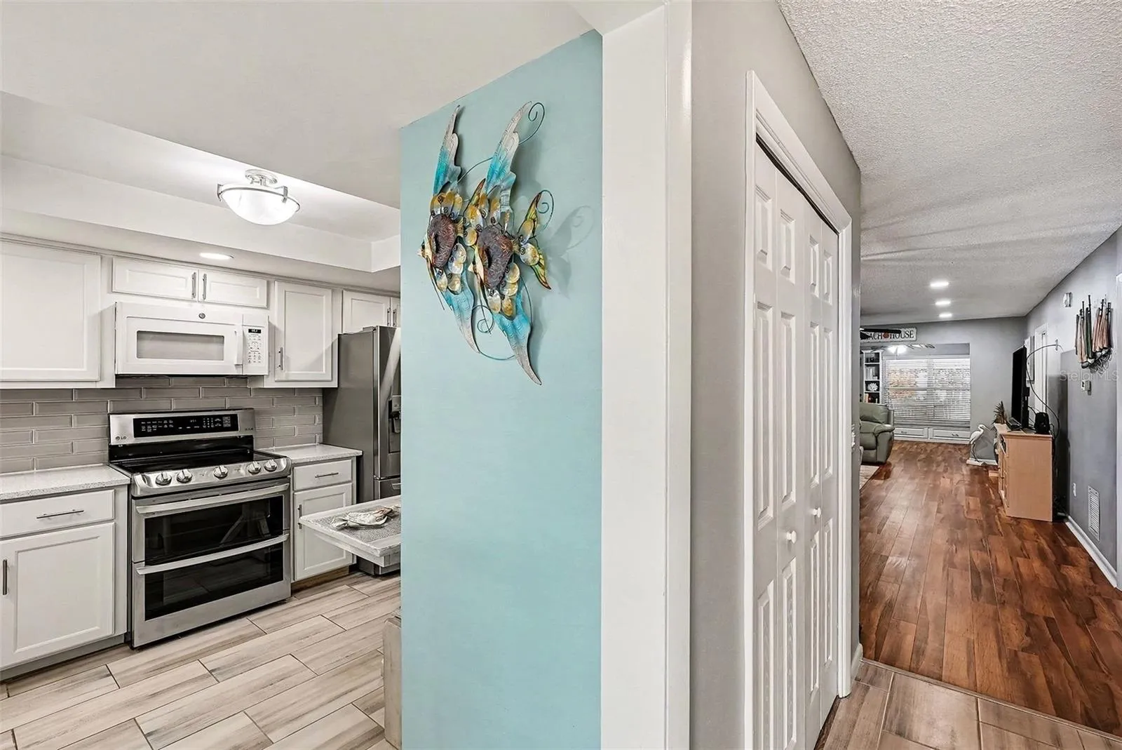Looking down the hallway and Kitchen to the left