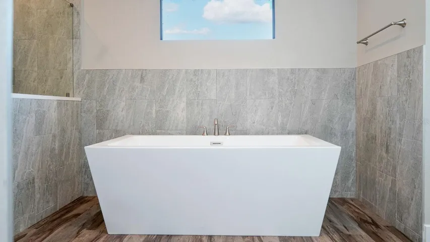 Soaking tub in primary bathroom