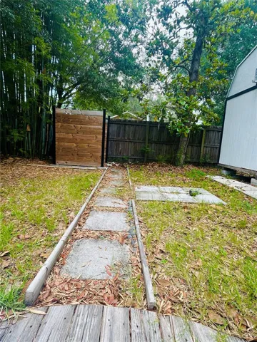 520 NW 26TH AVE 32609 GC541347 - BACK YARD VIEW WITH SHED/OUTDOOR SHOWER