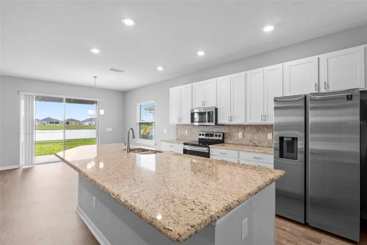 extra large kitchen isle with quartz counter top