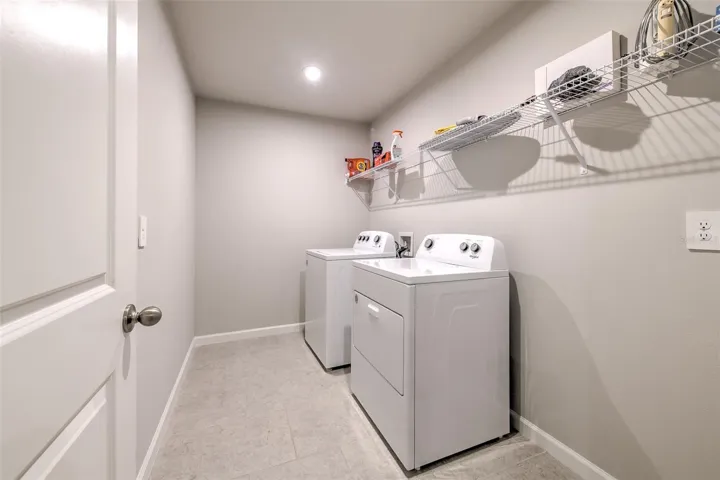 Oversized Laundry Room with Shelving