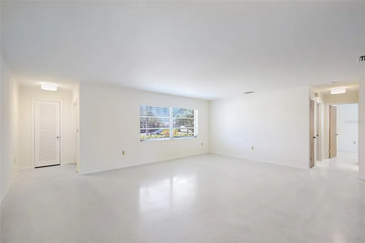 Living room with coat closet.