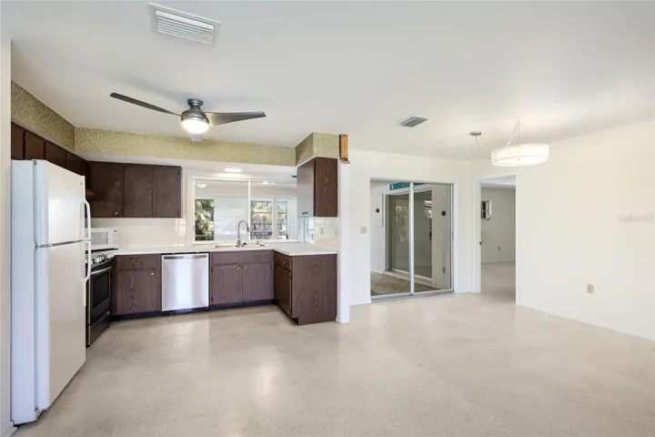 Living room opens to kitchen and dining room
