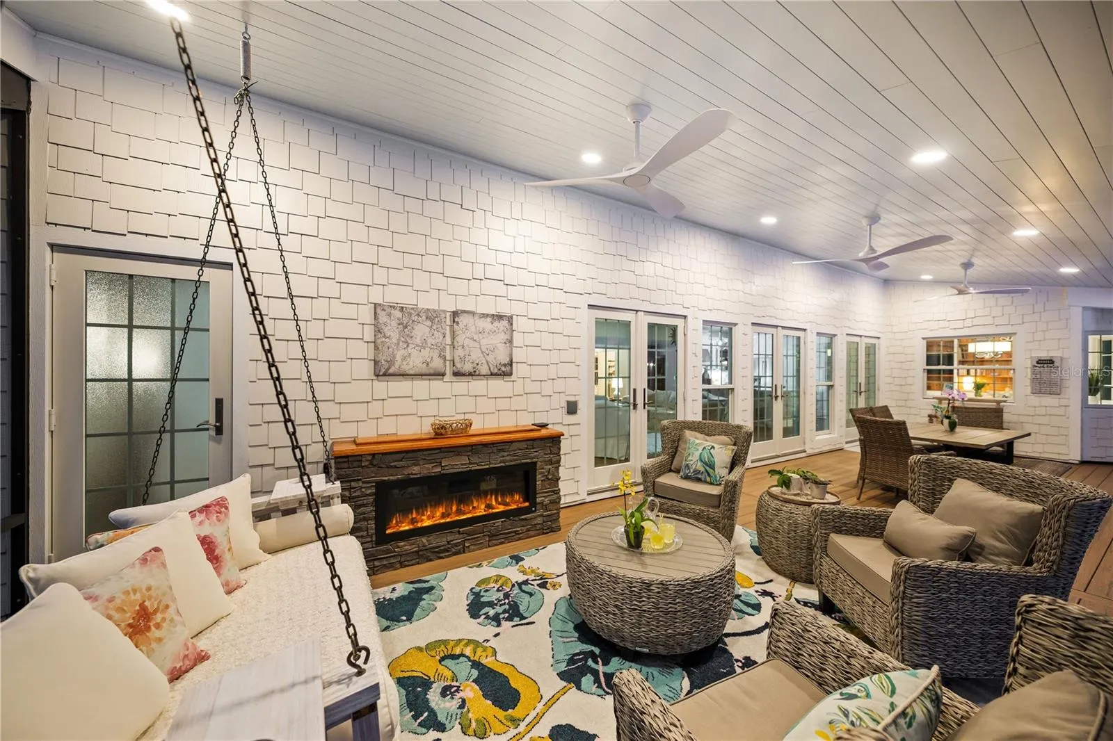 Back lanai with electric fireplace which houses motorized TV Lift