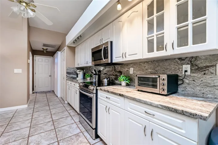 Down the hall, off the Kitchen is the designated Laundry closet and access to the 3 car garage.