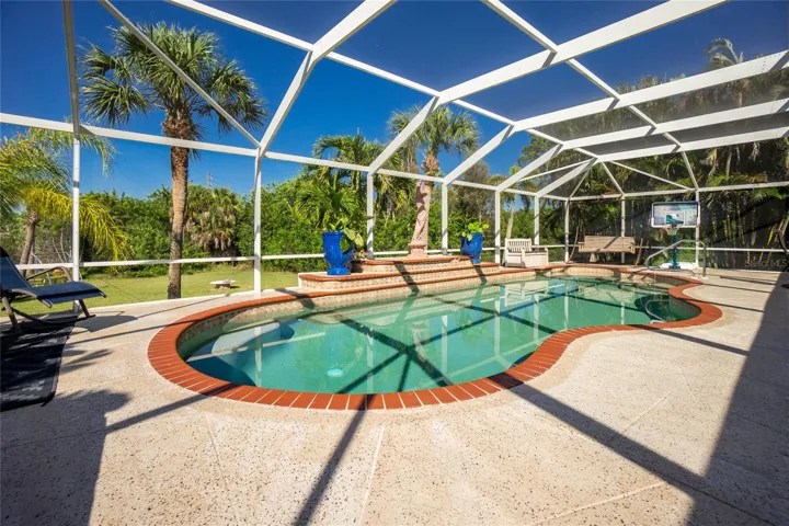 Opposite view of pool deck and landscape.