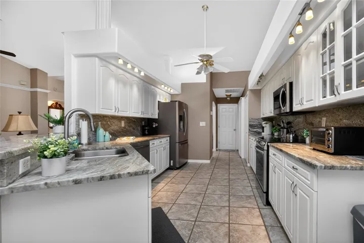 Here's a closer look at this gorgeous Kitchen. Granite counters, stainless appliances, and more make this a space to enjoy.
