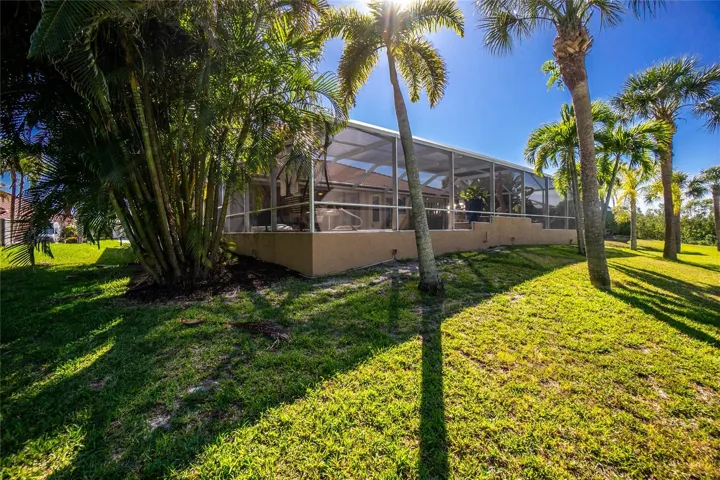 Tropical and mature landscaping feels like a vacation destination.