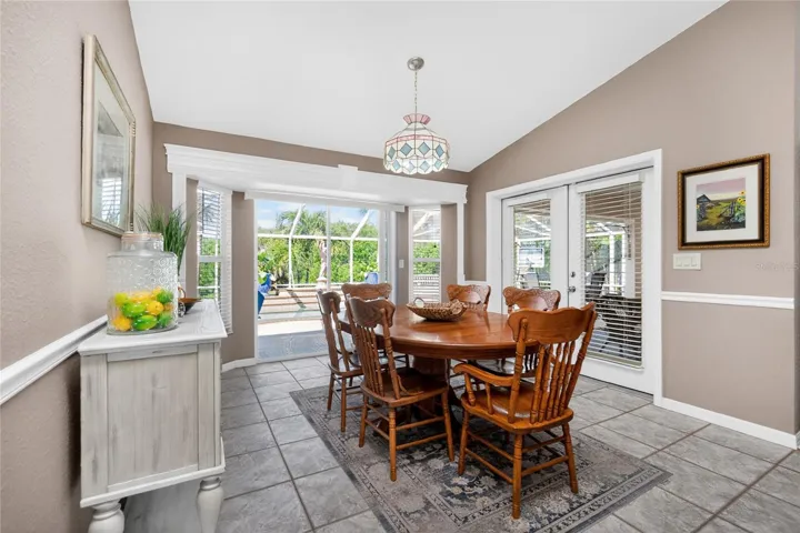 Look at this light and bright Dining room. You will be entranced with the beautiful views of the Florida flora and fauna, or keep an eye on the pool activities from the comfort of your chair.
