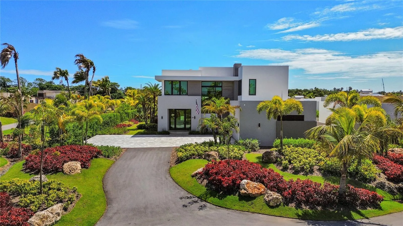 Nestled on a quiet cul-de-sac and offered fully furnished, this exceptional two-story residence combines elegant design, resort-style amenities, and convenient access to the beach. Located just moments from the golf cart path, residents can easily reach the underground tunnel that provides direct access to the shoreline