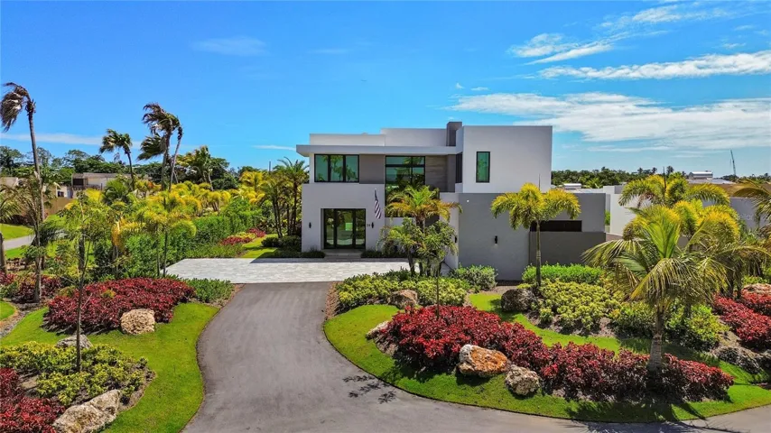 Nestled on a quiet cul-de-sac and offered fully furnished, this exceptional two-story residence combines elegant design, resort-style amenities, and convenient access to the beach. Located just moments from the golf cart path, residents can easily reach the underground tunnel that provides direct access to the shoreline