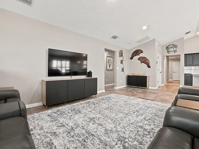 THE OPENING TO THE LEFT LEADS TO THE PRIMARY SUITE AND 2ND GUEST ROOM.