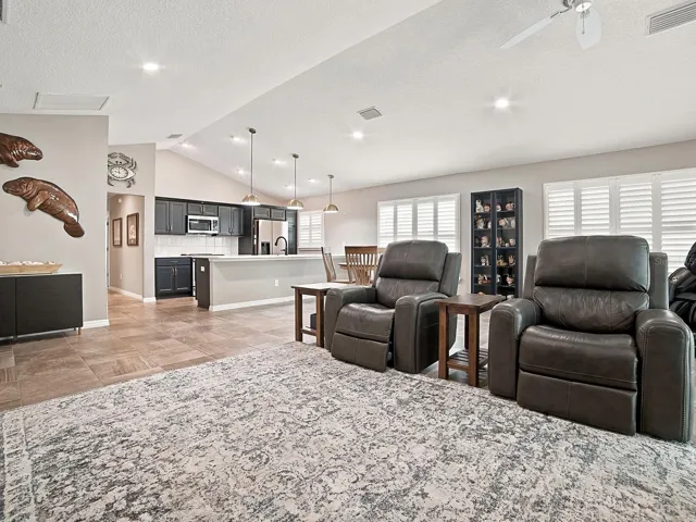 CATHEDRAL CEILING IN LIVING ROOM - PLANTATION SHUTTERS THROUGHOUT!