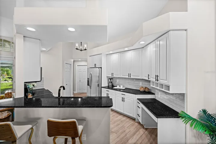 Granite tops and lots of cabinets in the kitchen