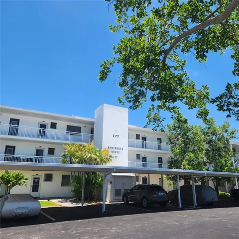 The front entry offers covered parking for each unit, and a generous amount of guest parking for a second vehicle